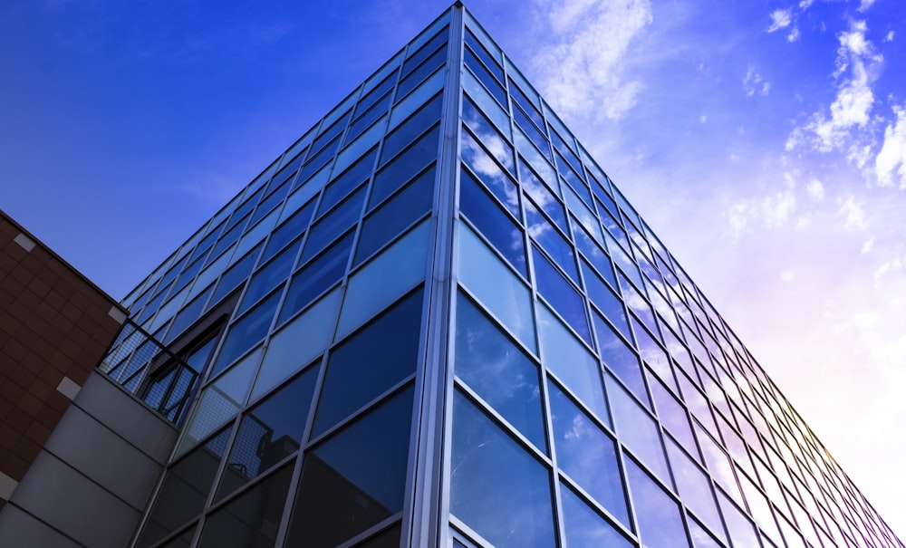 glass walled high rise building under blue sky during daytime