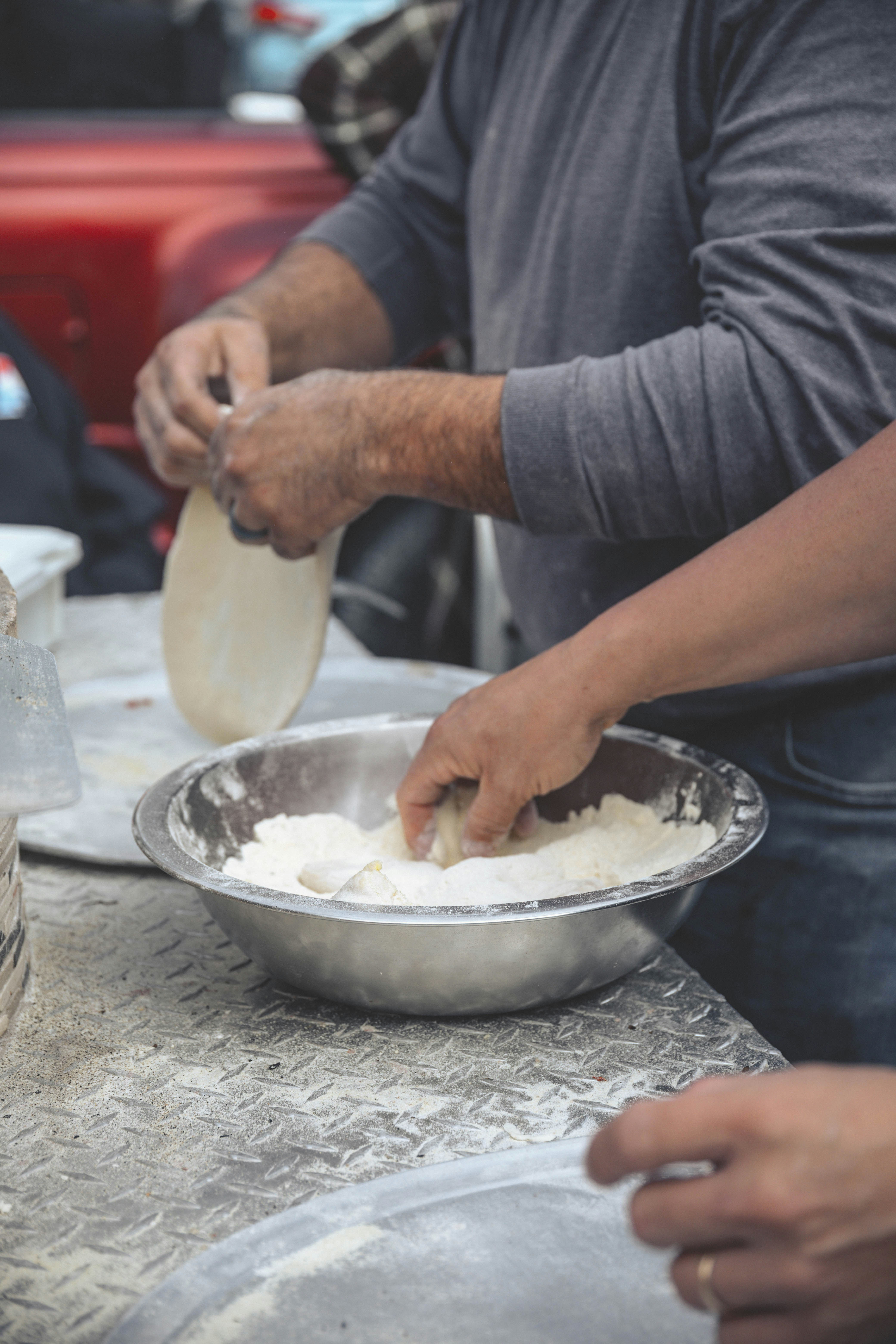 person holding white plastic container