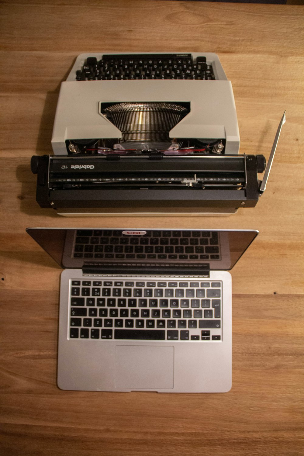 macbook pro on brown wooden table