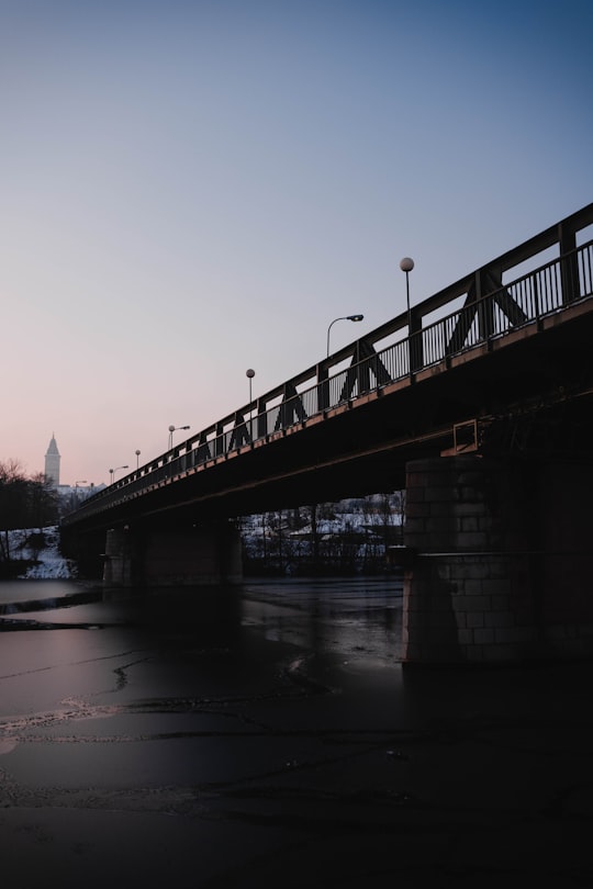 bridge over river during sunset in Enns Austria