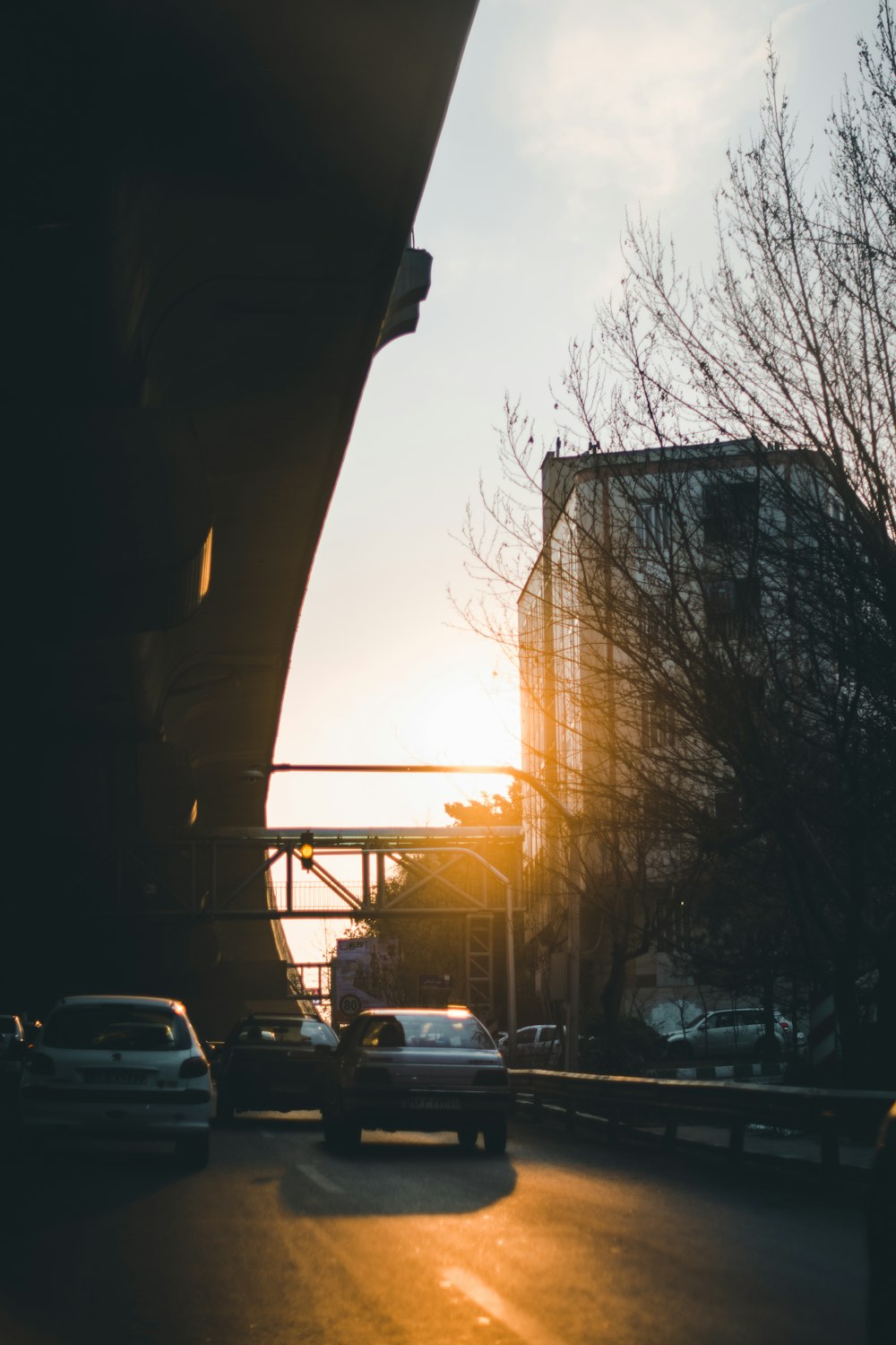 cars parked on parking lot during sunset