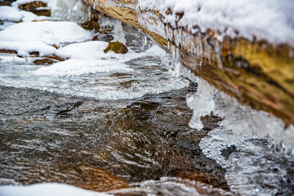 water flowing on brown rock