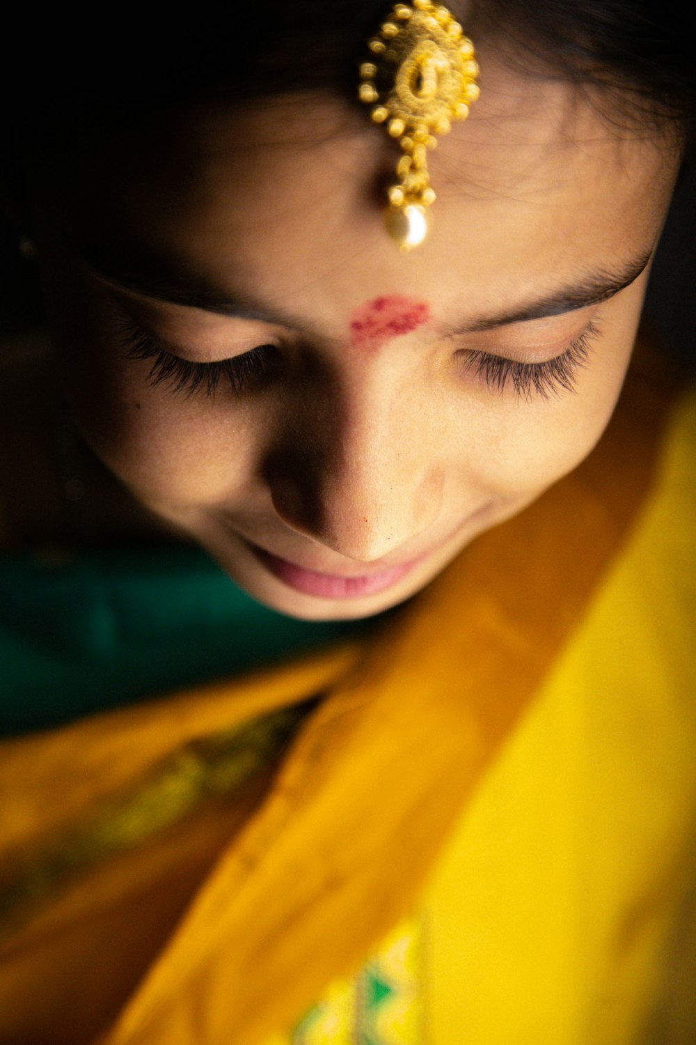 woman with silver diamond stud earring