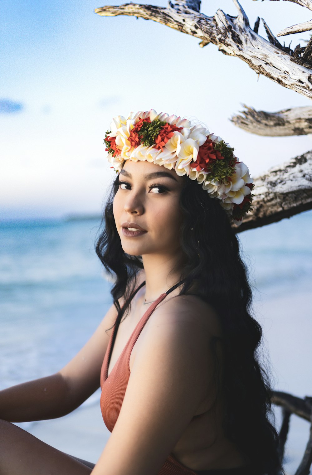 woman in white and red floral headband