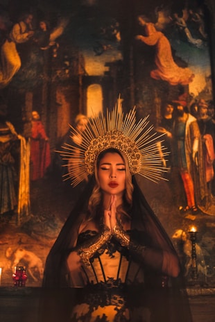 woman in brown dress with gold crown