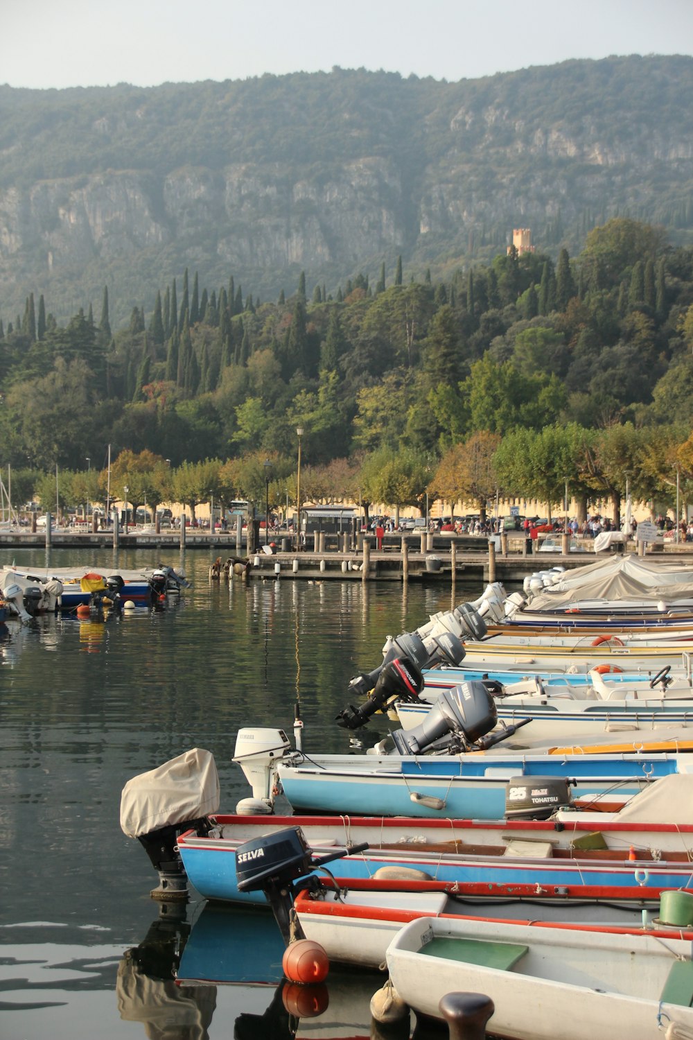 white and red boat on body of water during daytime