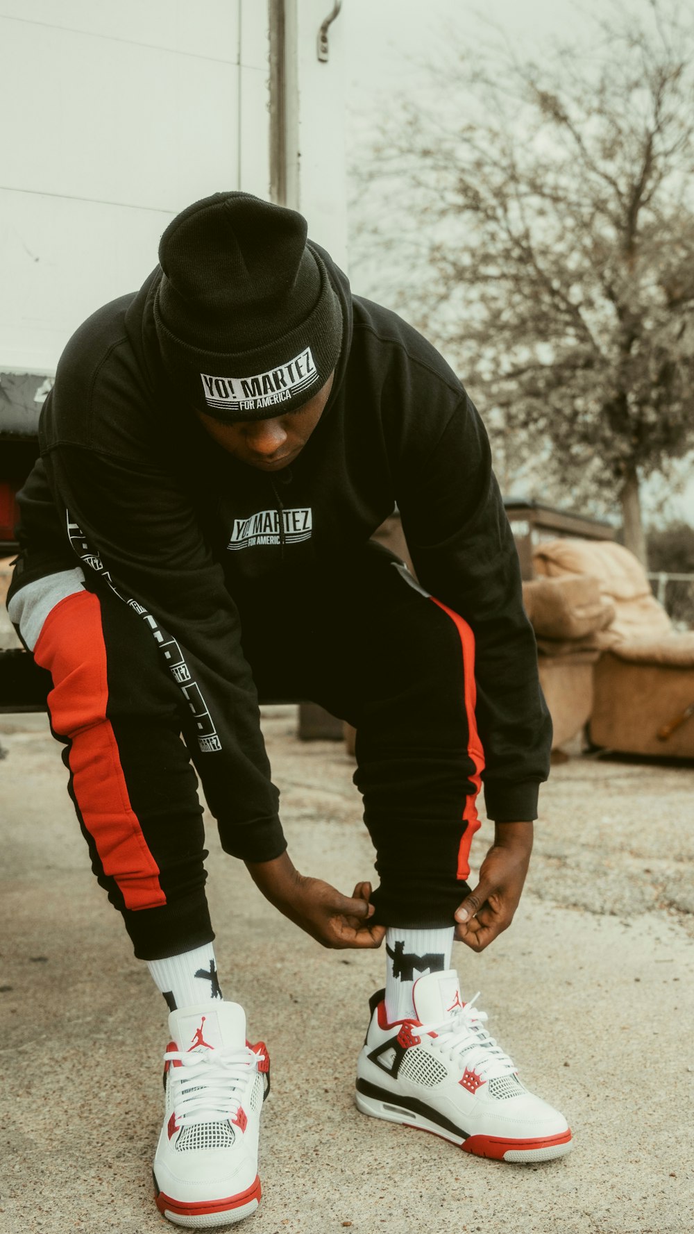 man in black and red jacket and black pants