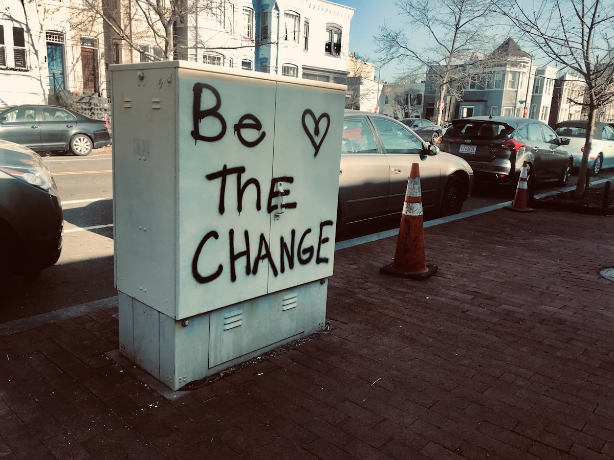 Be the change spray painted on object near a street.