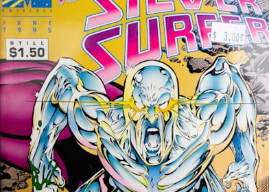 A graphic depiction of a muscular, shiny humanoid figure with an intense expression and glowing yellow eyes, set against a dynamic background featuring broken rocks and a bold, colorful title. The comic book cover has a retro design with a price tag indicating $1.50 and a sticker showing $3.00.