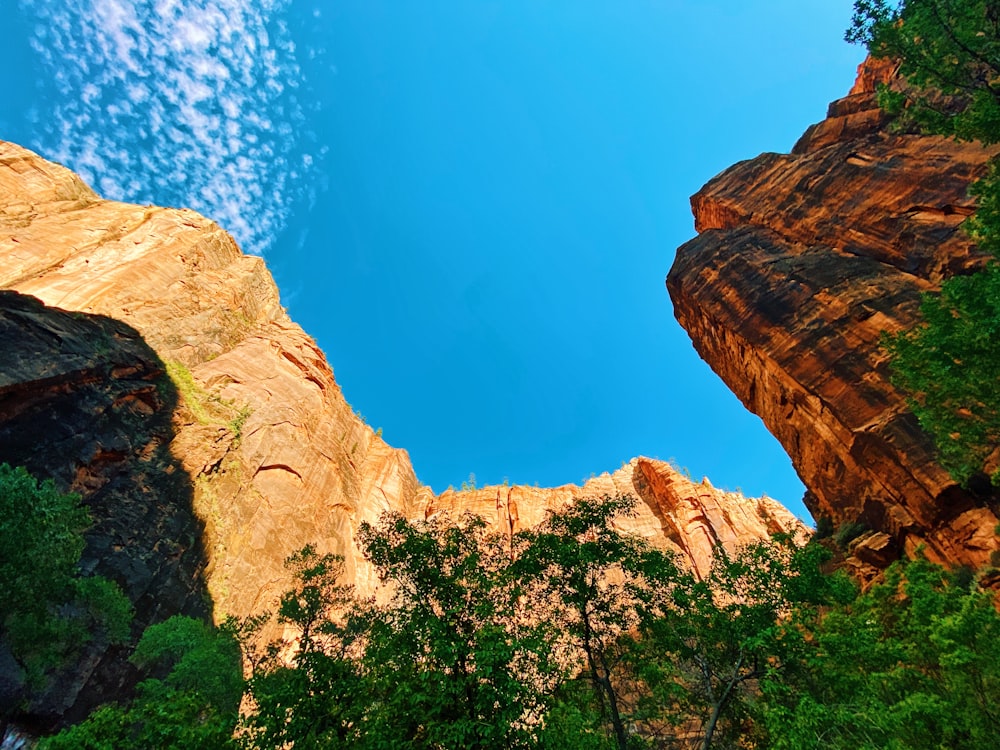 brown rock formation under blue sky during daytime