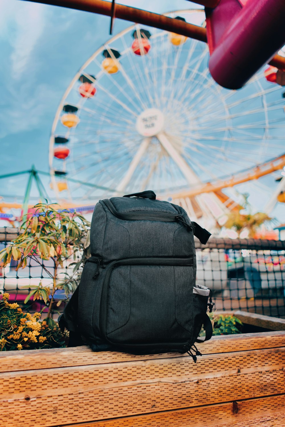 black backpack on brown wooden table