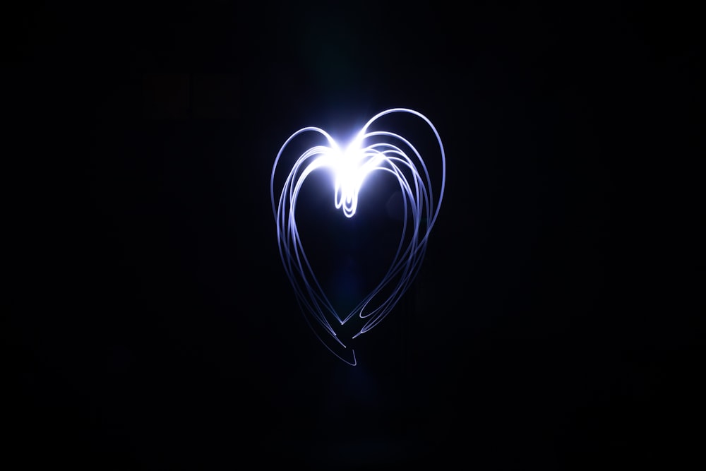 white heart light in dark room