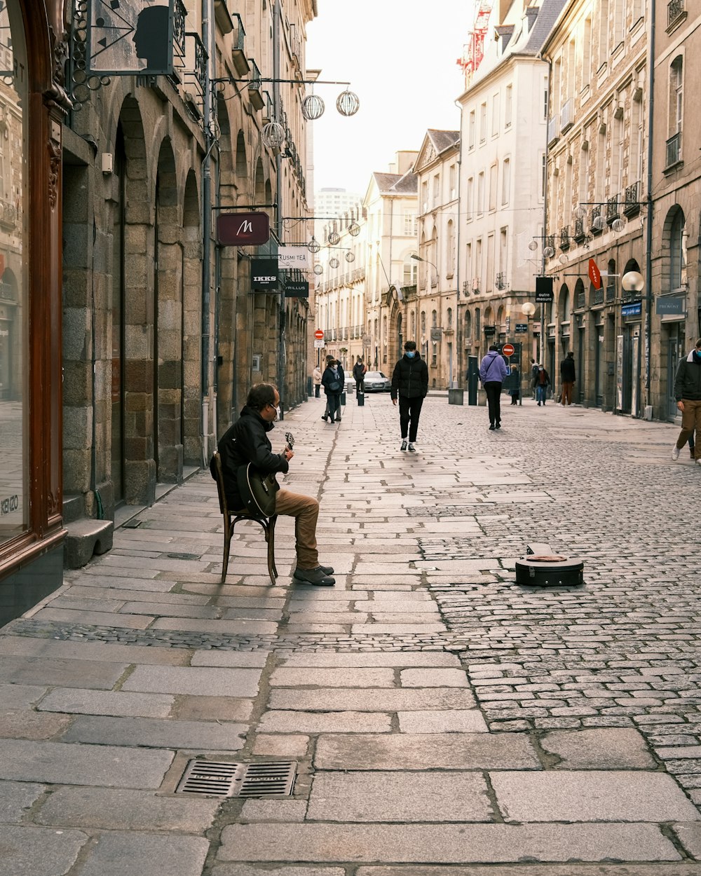 people walking on sidewalk during daytime