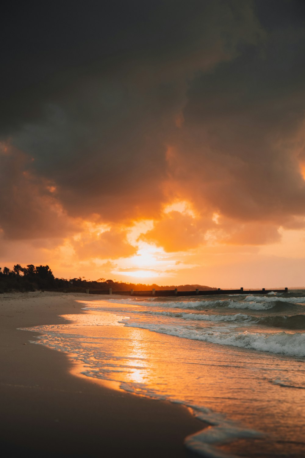 body of water during sunset