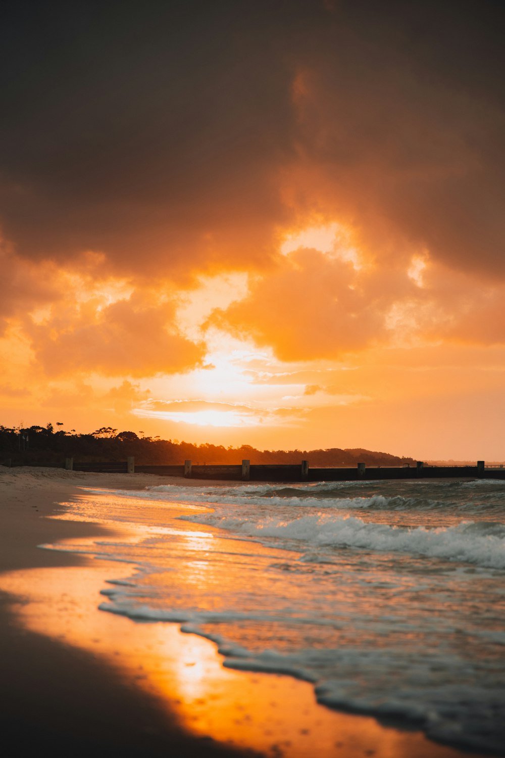 body of water during sunset