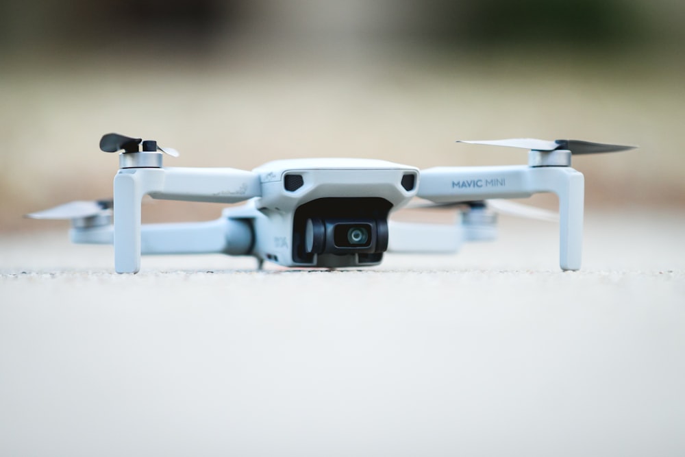 white and black drone on white table