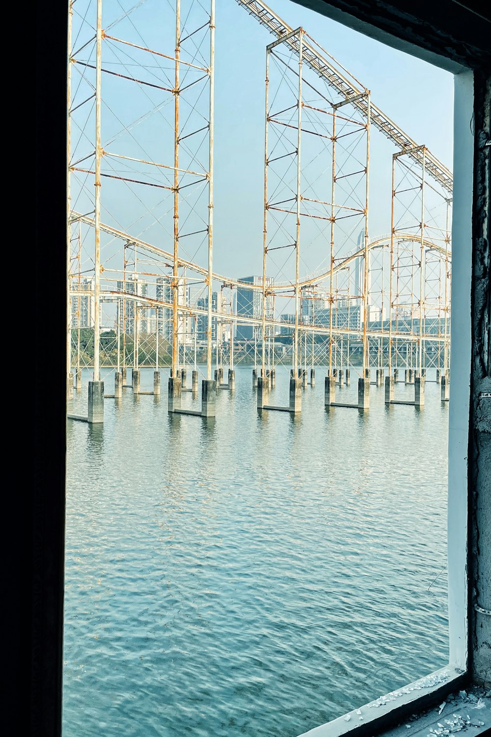 white metal bridge over blue sea during daytime