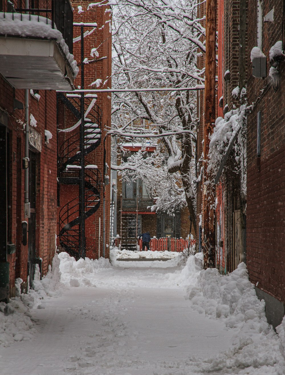 brown brick building covered with snow