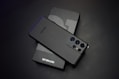 black sony remote control beside white tissue paper