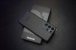black sony remote control beside white tissue paper