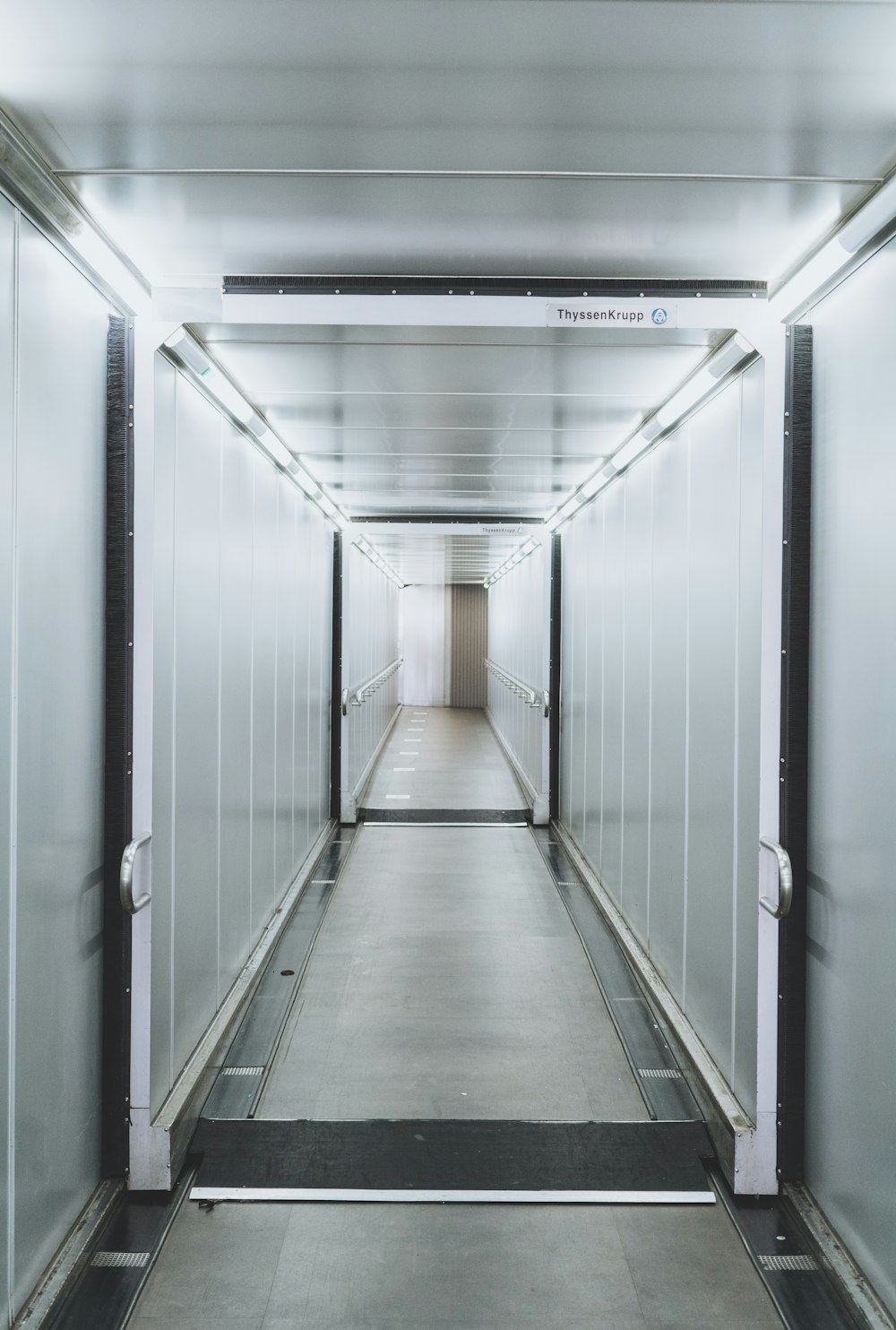 empty hallway with lights turned on in the hallway