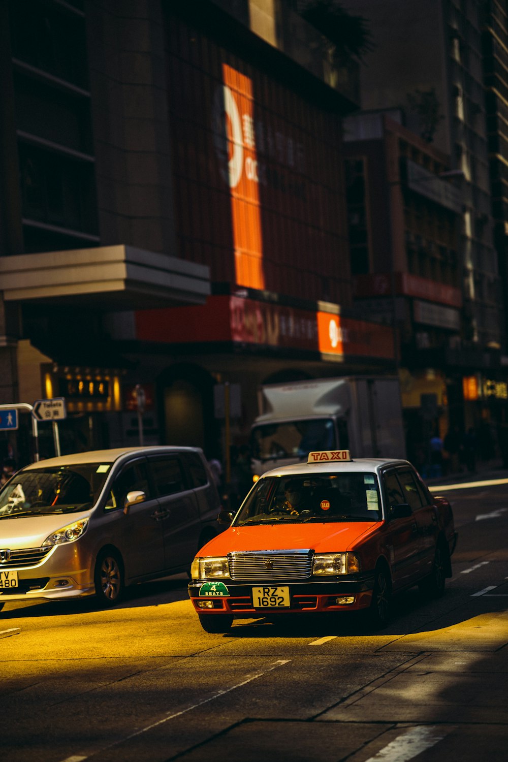 yellow and black taxi cab on the street during daytime