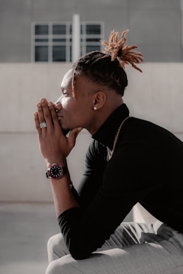 man in black long sleeve shirt smoking cigarette