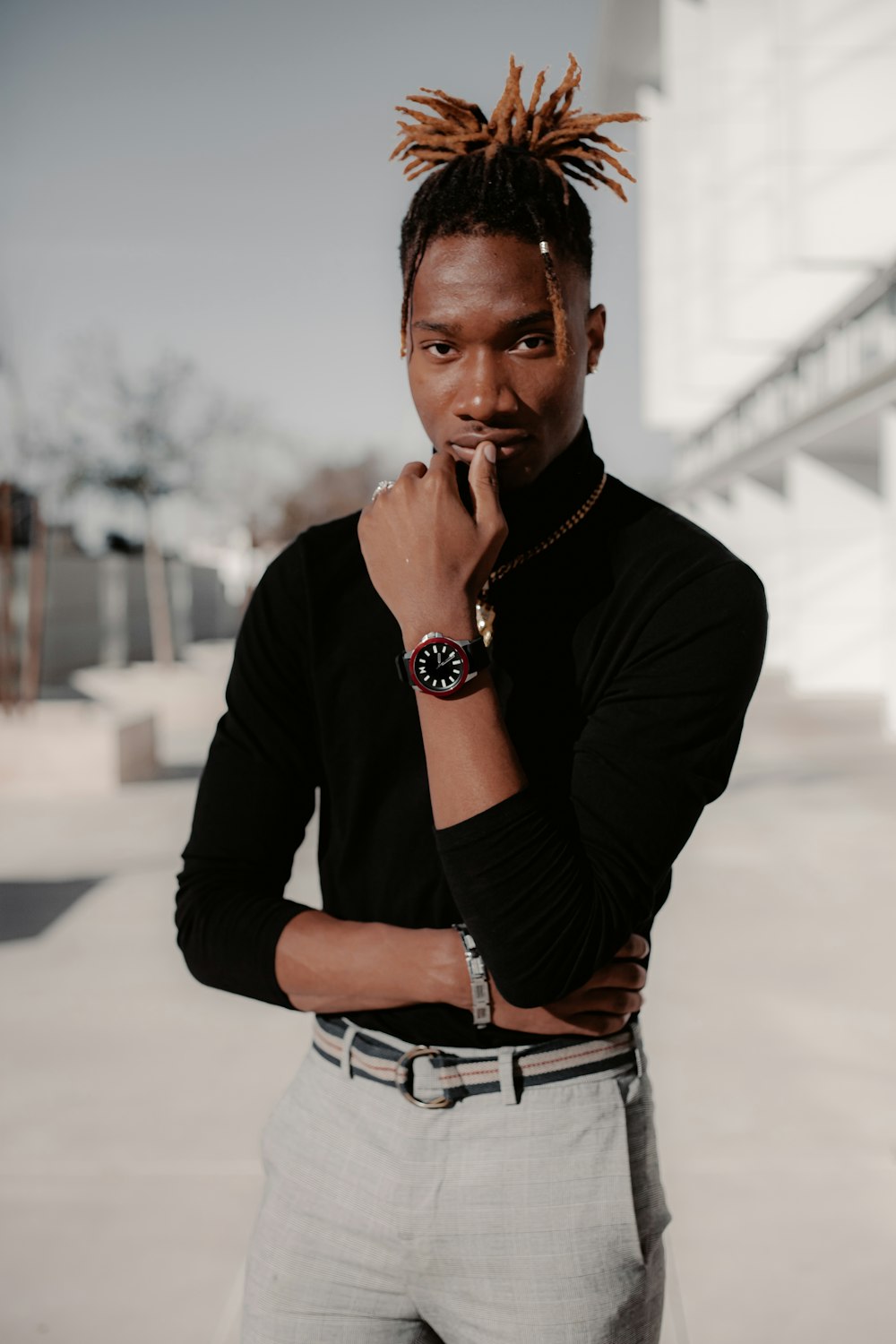 man in black long sleeve shirt and blue denim jeans