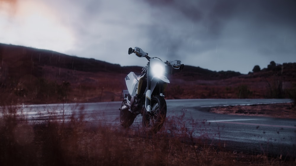 white and black motorcycle on road during daytime