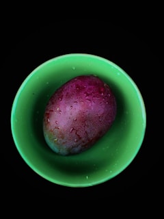 Close-up of vibrant mango fruit pulp in a rustic bowl