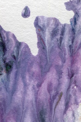 A playful watercolor background with layered textures in shades of lilac and blue, suggesting movement.