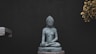 gray concrete buddha statue on black background