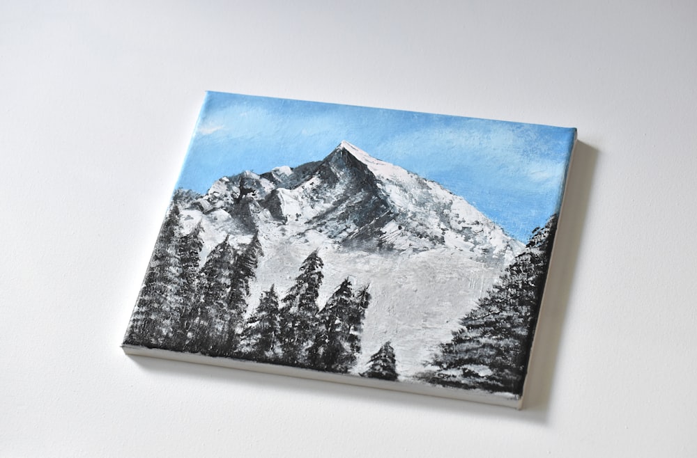 snow covered mountain painting on white wall