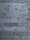 Roughly textured concrete wall composed of horizontal wooden planks. The surface exhibits an industrial and rugged appearance with visible grains, knots, and imperfections in the wood casting.