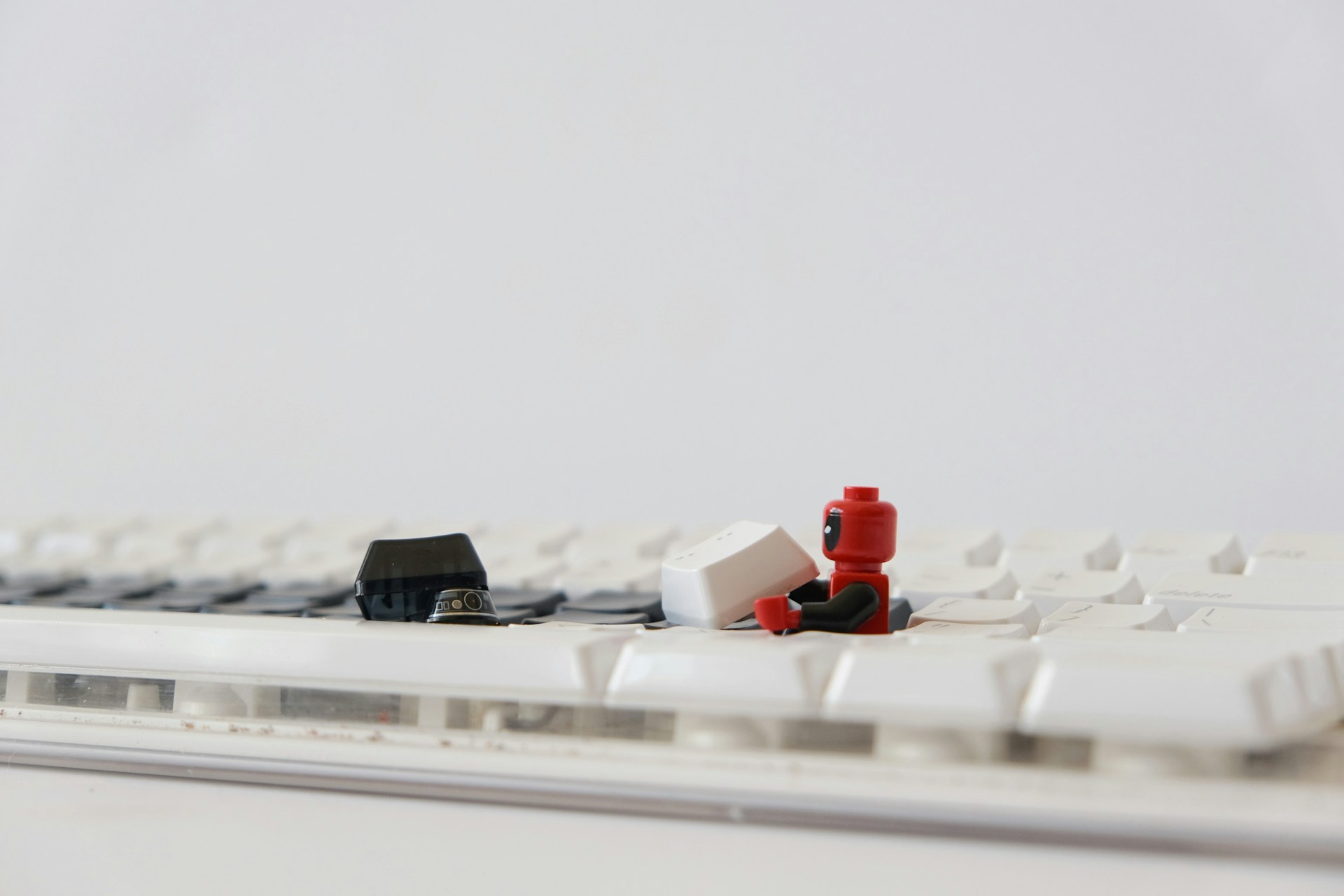 red and white plastic toy on white table