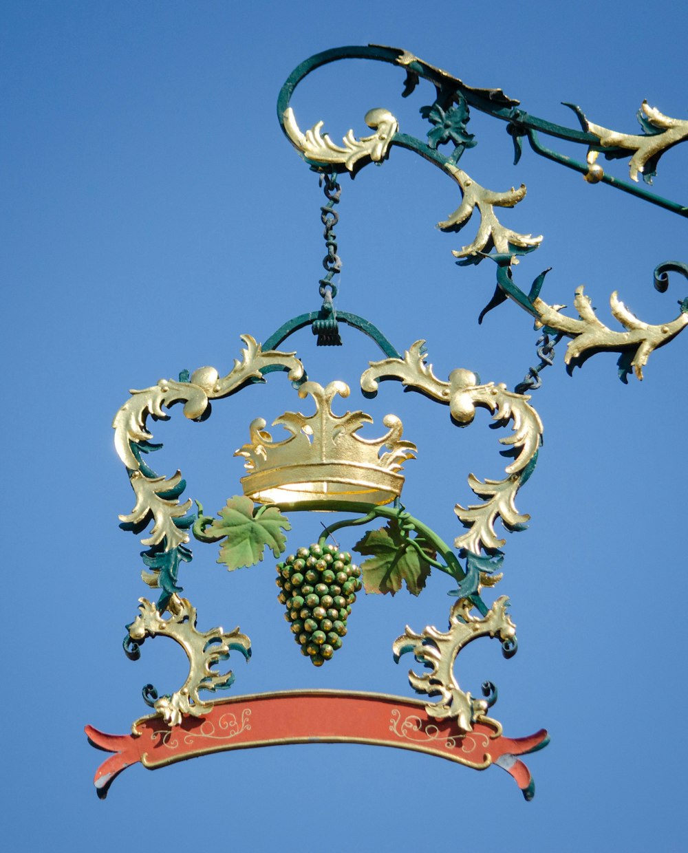 brass and red floral pendant lamp