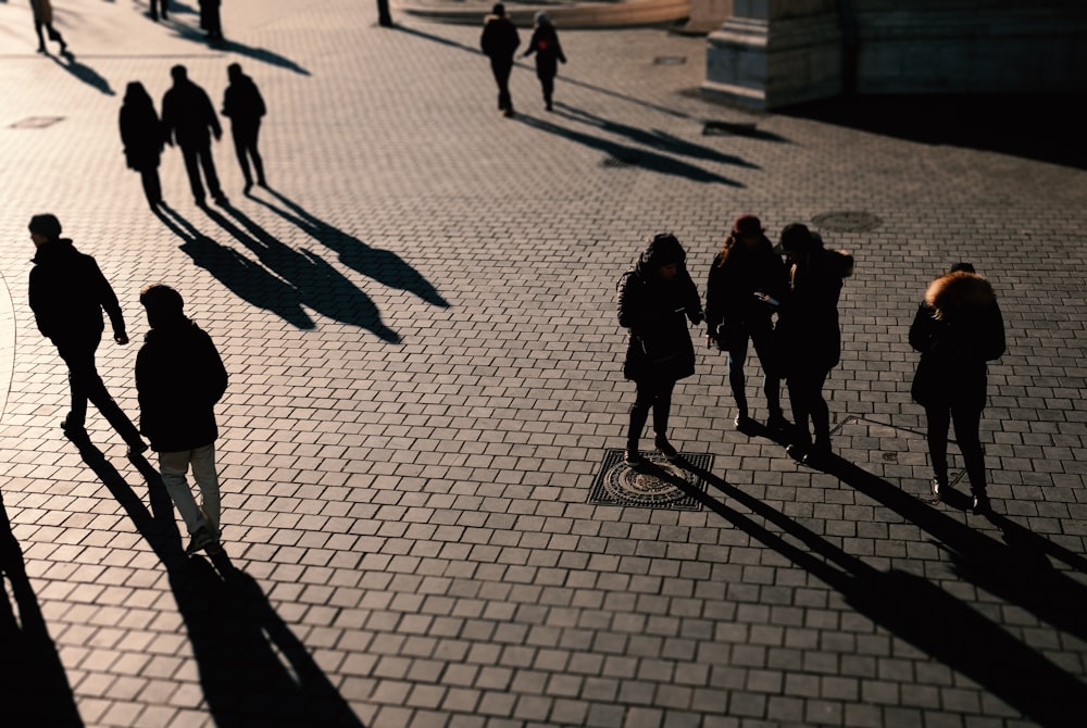 people walking on sidewalk during daytime