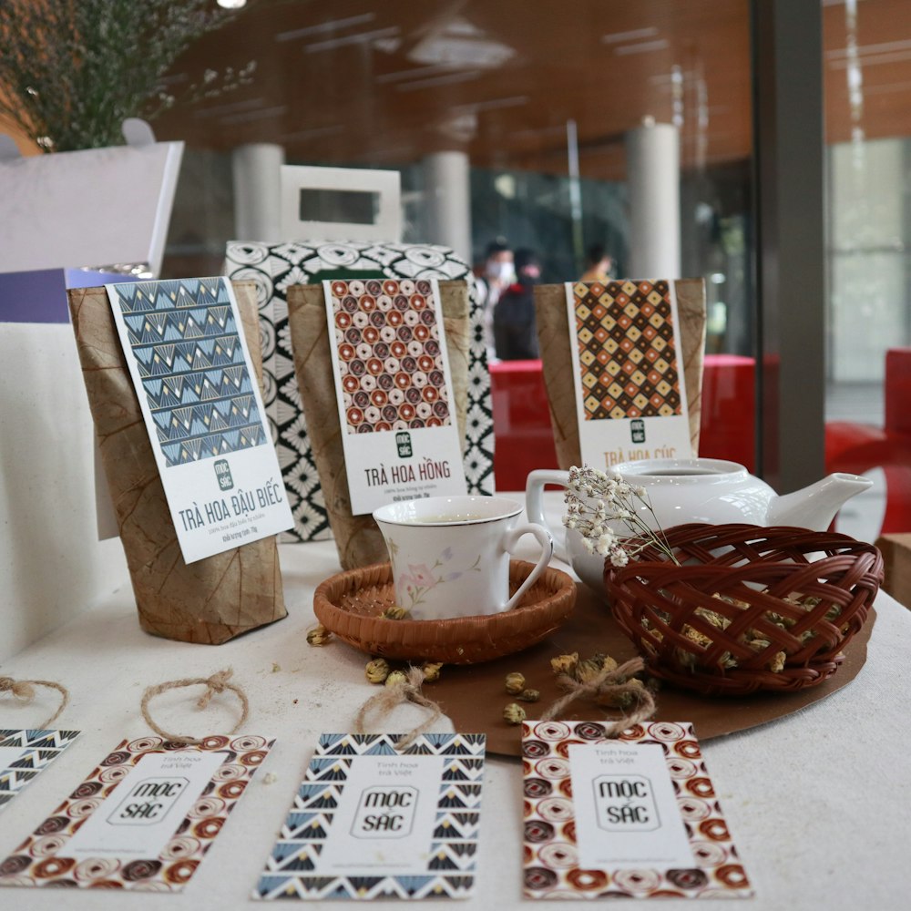 white and red polka dot gift box on table