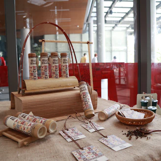A sleek display of assorted products from Mr. Ishii, Mak Ijah, and Crabcraze arranged on a modern wooden table.