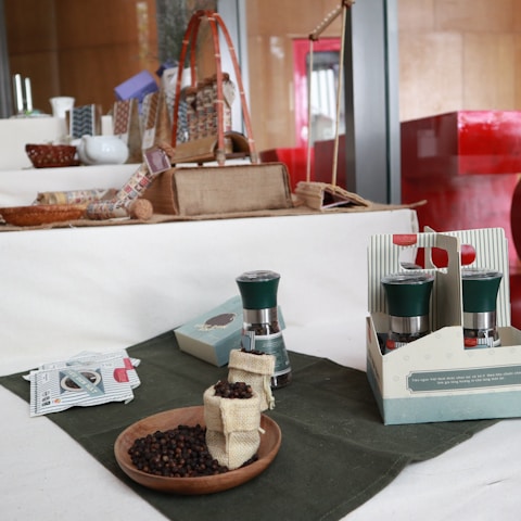 A close-up photo of Tumini seasoning packets arranged neatly on a wooden kitchen table.