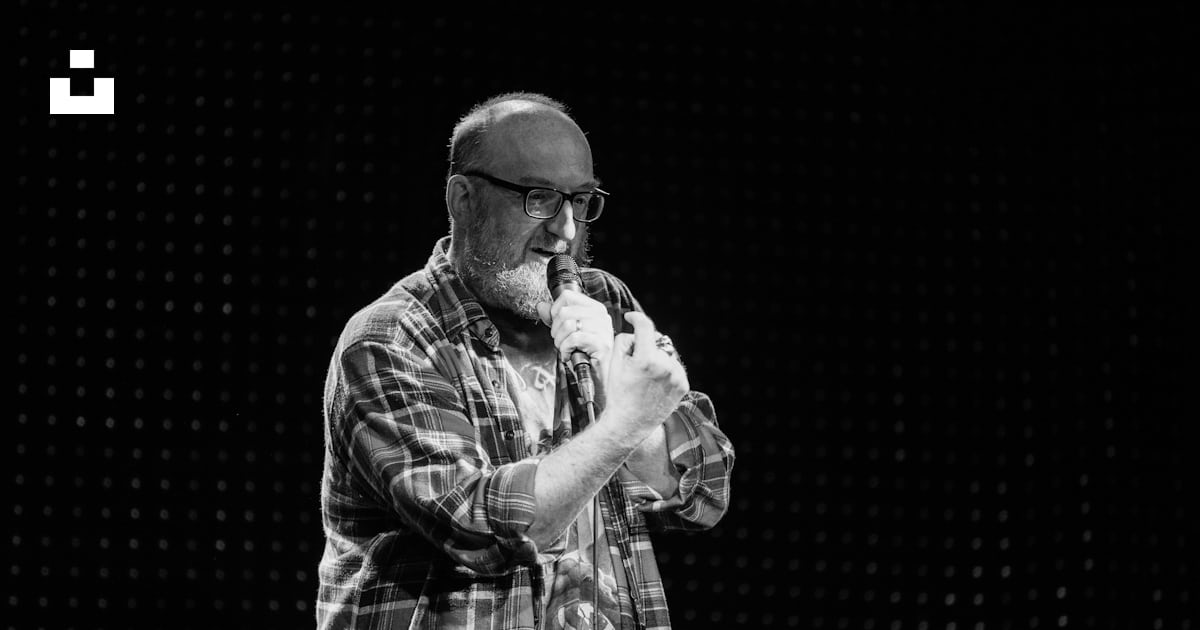 Man In Plaid Button Up Shirt Drinking From Bottle Photo Free Grey man-in-plaid-button-up-shirt-drinking-from-bottle-photo-free-grey