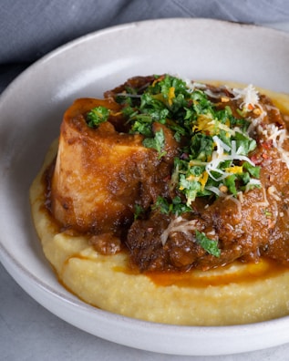 A hearty meatloaf with mashed potatoes and gravy.