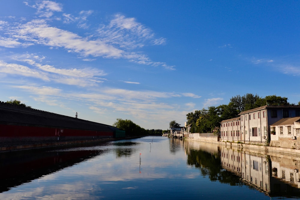 body of water near building during daytime