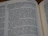 Close-up of an open book showing a gripping passage from 'It Happened on the DMZ' with warm lighting.