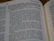 Close-up of an open book showing a gripping passage from 'It Happened on the DMZ' with warm lighting.