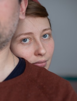 woman in red and black shirt