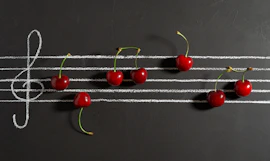 red cherries on black surface