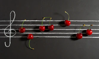 red cherries on black surface