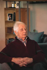 An elderly man enjoying a safe and comfortable moment in his cozy living room.