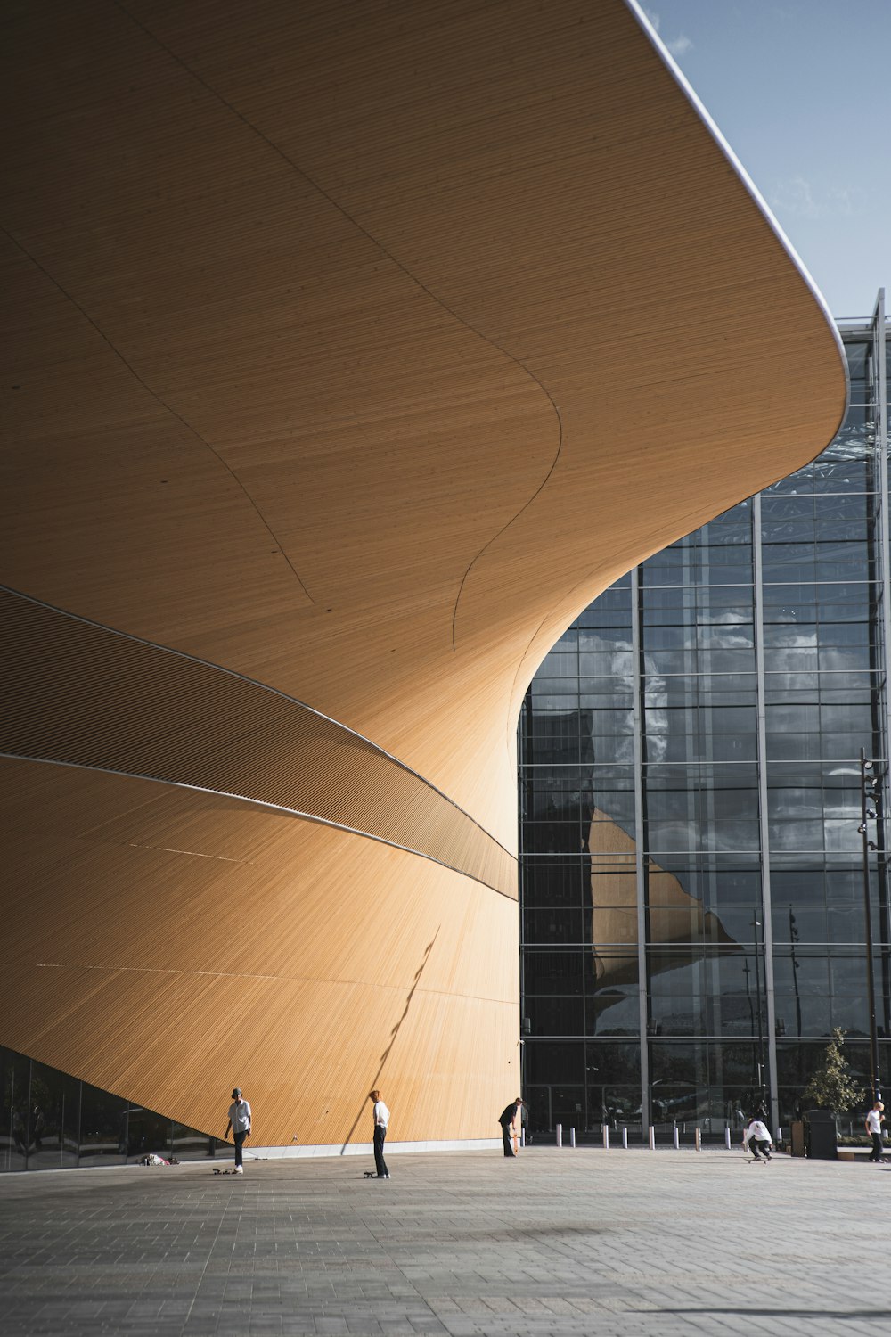 brown wooden round table near glass building